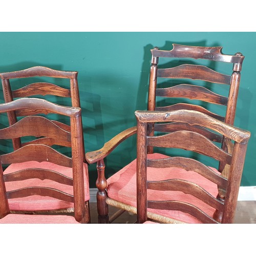 567 - A set of eight 19th Century ash and elm ladderback Chairs with rush seats and squab cushions on turn... 