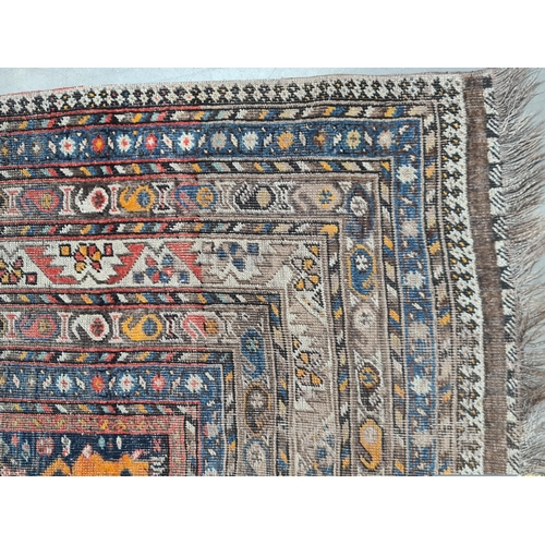 936 - A multi-bordered Shirvan Rug with central field of trees and birds, spandrels with mustard tigers, 1... 