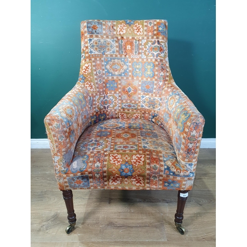 643 - A 19th Century button back Armchair with chiefly red upholstery with all over geometric style design... 