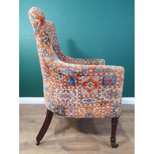 643 - A 19th Century button back Armchair with chiefly red upholstery with all over geometric style design... 