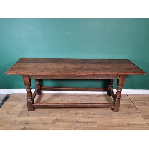 601 - A 17th Century oak Refectory Table with cleated three plank top above leafage arcade carved frieze r... 