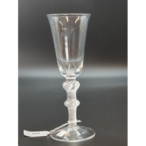 889 - A tall Wine Flute with single knop to the air twist stem, domed base with spreading frost, and anoth... 