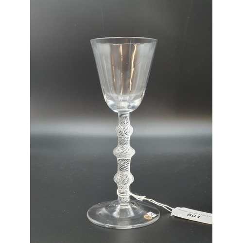 891 - A balustroid wine glass with air twist stem, triple knop with plain bucket bowl 6 3/4in H