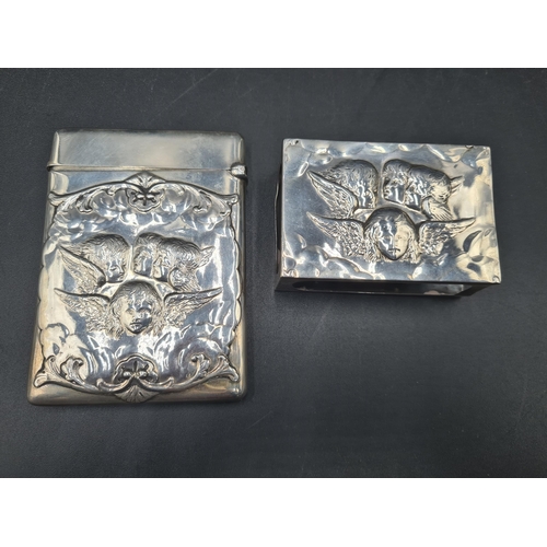 101 - A Victorian silver Card Case embossed cherub masks, etc, London 1900, maker: Wm Comyns, and a matchi... 