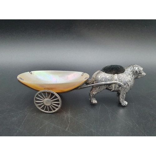 112 - A George V silver Pin Cushion in the form of a dog pulling a mother of pearl two wheeled cart, Birmi... 