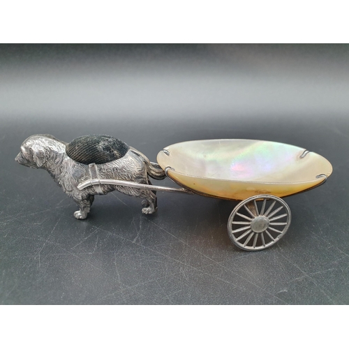 112 - A George V silver Pin Cushion in the form of a dog pulling a mother of pearl two wheeled cart, Birmi... 