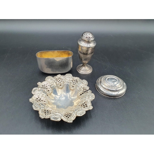 119 - A George III silver urn shape Pepperette, London 1801, a Spirit Flask Base, Sheffield 1912, an embos... 