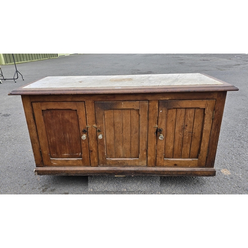 15 - A Victorian marble topped Cupboard with mahogany top and pine base fitted three doors on plinth base... 