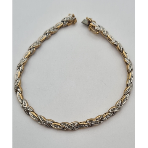 164 - A two coloured 9ct gold Bracelet set diamond chips, approx 18cms long, approx 9.50gms