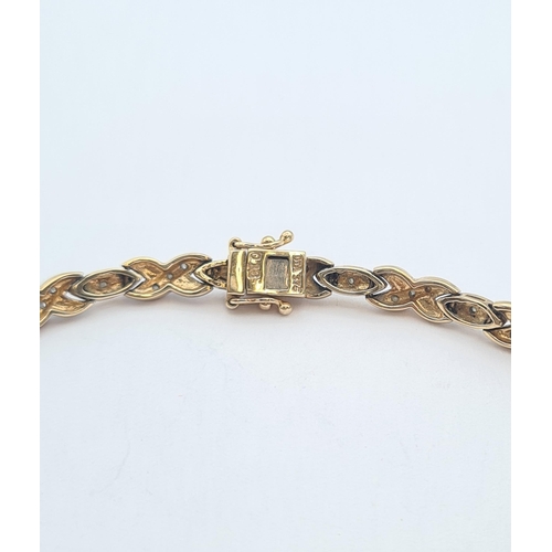 164 - A two coloured 9ct gold Bracelet set diamond chips, approx 18cms long, approx 9.50gms