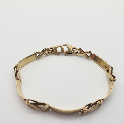 198 - A 9ct Gold Link Bracelet comprising rectangular and figure of eight links, with 'Friends' engraved t... 