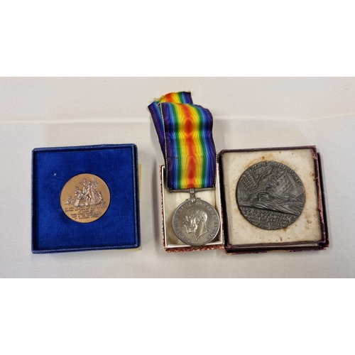 222 - A WWI Medal awarded to PTE S. John, Welsh Regiment, a Lusitania Medallion and a 150 year commemorati... 