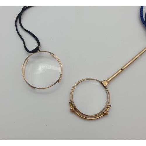 230 - A pair of gold plated Lorgnettes, maker W&C and a yellow metal Monocle,