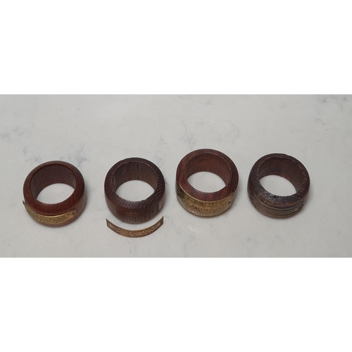 239 - Four treen Napkin Rings made from the wood of famous ships with gilt metal plaques (one detached), T... 