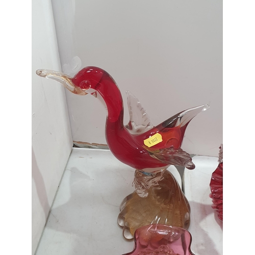 266 - A quantity of cranberry and red Glass including a model of a Bird in flight, a Basket, Bowls, a Roya... 