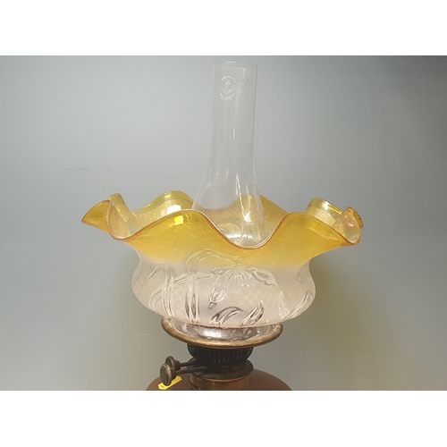 274 - A Victorian brass and copper Paraffin Lamp with flared moulded shade having amber rim, 20in H, (R4)