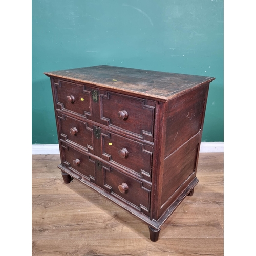 29 - An 18th Century and later oak Chest of three long drawers with geometric moulding raised on turned s... 