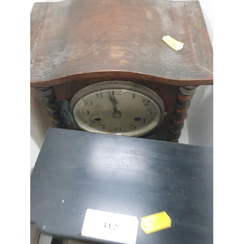 312 - An oak cased Mantel Clock, a slate and marble Mantel Clock, an Edwardian mahogany Mantel Clock and t... 