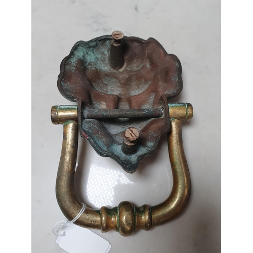 329 - A heavy brass mask Door Knocker, R4)