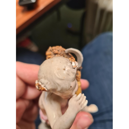 348 - A pair of Continental porcelain Figures of Putti and another of a Gamebird (R4)