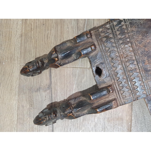 38 - An Ashanti Figure, a carved wood African Lock/Door Latch carved with two figures above linear design... 