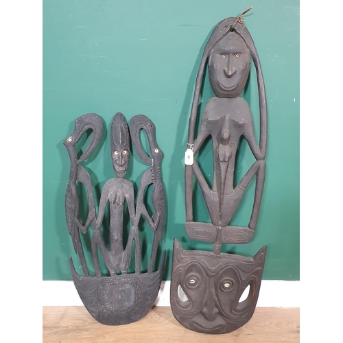 39 - A pair of ebonised African Tribal Carvings with cowrie shell eyes 3ft 3in H and 2ft 4in H (R5)