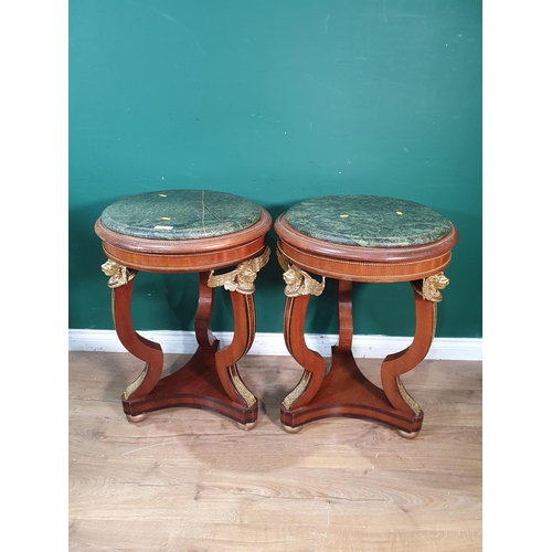 44 - A pair of Empire style mahogany Occasional Tables with marble tops and gilded winged angel decoratio... 