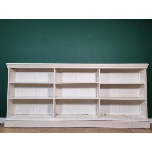 456 - A white painted three bay Bookcase with adjustable shelves 8ft 10in W x 4ft H (R5)