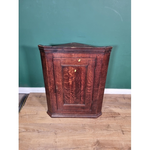 491 - An antique oak hanging Corner Cupboard fitted single fielded panel door 3ft 2in H x 2ft 6in W (R5)