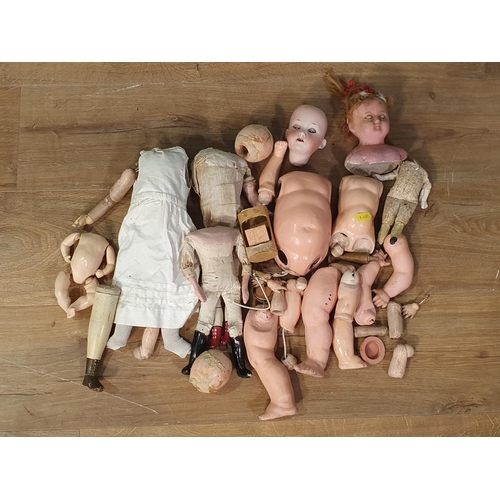 495 - A box containing parts of Dolls, (R3)