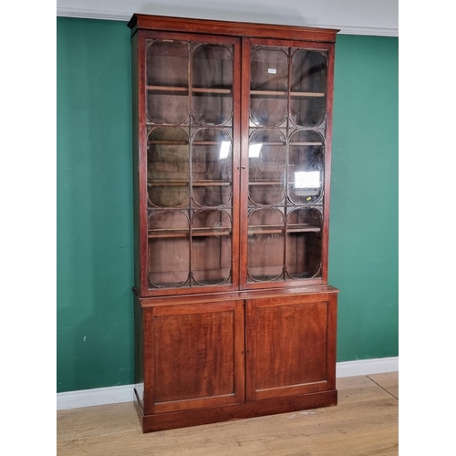 537 - A 19th Century mahogany Bookcase the upper section fitted pair of glazed doors enclosing adjustable ... 