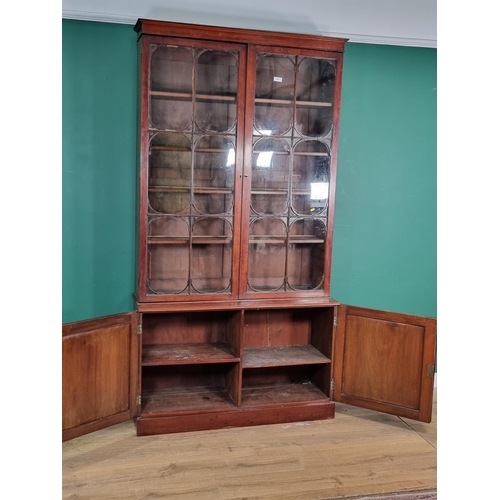 537 - A 19th Century mahogany Bookcase the upper section fitted pair of glazed doors enclosing adjustable ... 