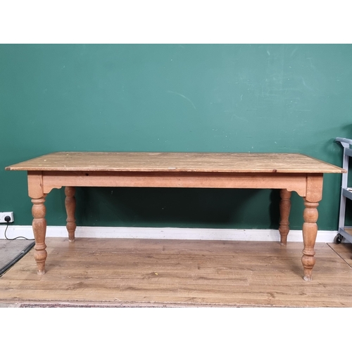 541 - An antique pine Farmhouse Table with cleated top raised on turned supports 7ft L x 2ft 6in H (R5)