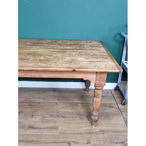 541 - An antique pine Farmhouse Table with cleated top raised on turned supports 7ft L x 2ft 6in H (R5)