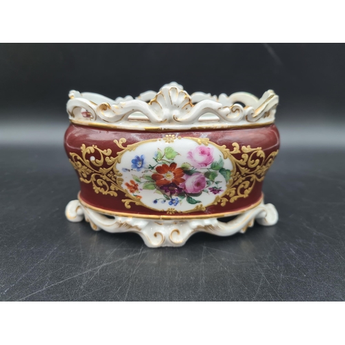 55 - A 19th Century French porcelain Inkwell with two wells and pen holders, painted floral bouquets, cla... 