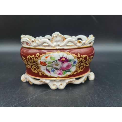 55 - A 19th Century French porcelain Inkwell with two wells and pen holders, painted floral bouquets, cla... 