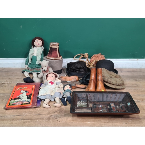 572 - A box of Dolls, wooden Shoe Trees, Hats, etc. (R5)