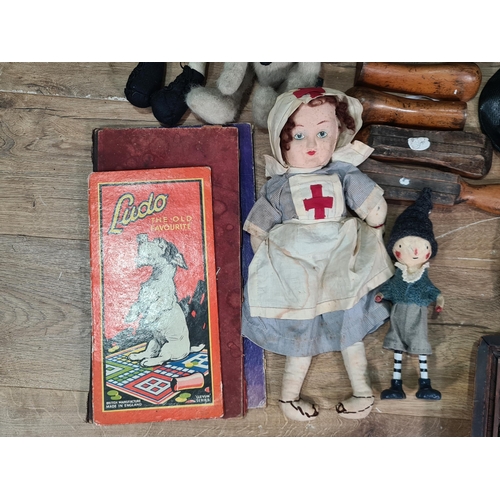 572 - A box of Dolls, wooden Shoe Trees, Hats, etc. (R5)