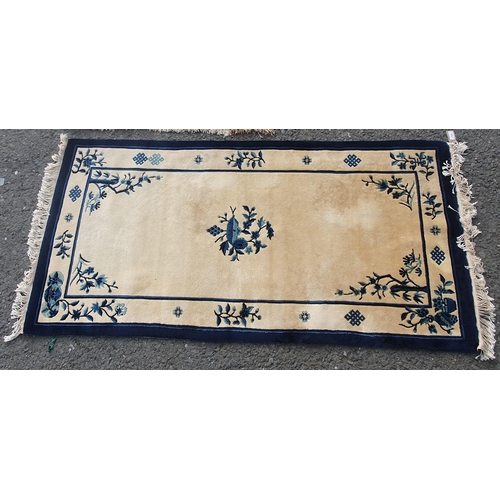 575 - A Chinese hand knotted Runner with traditional motifs on an ivory ground, 3ft x 6ft 2in