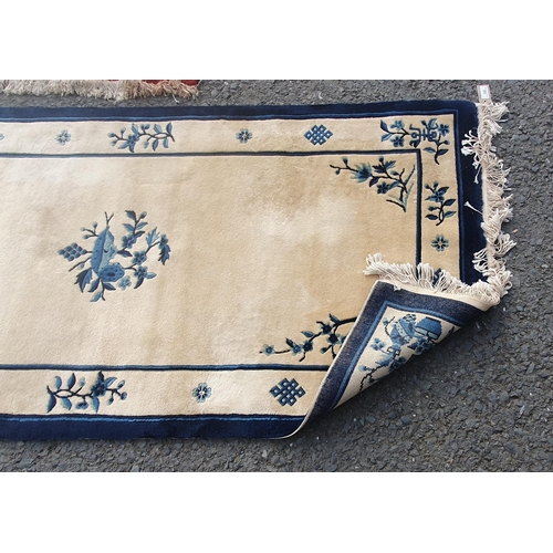 575 - A Chinese hand knotted Runner with traditional motifs on an ivory ground, 3ft x 6ft 2in