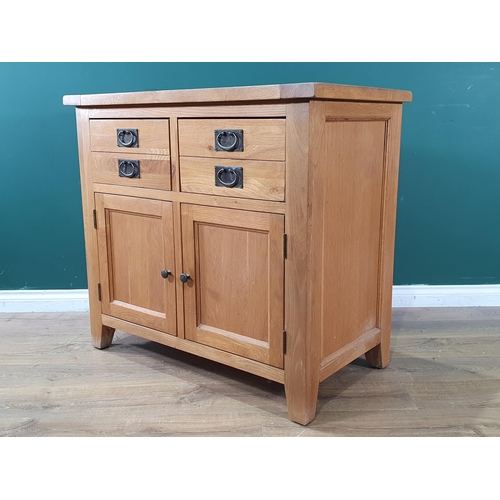 609 - A modern oak Cupboard fitted two frieze drawers above pair of doors 3ft 3in W x 3ft H (R7)