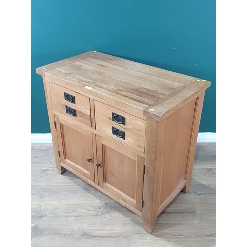 609 - A modern oak Cupboard fitted two frieze drawers above pair of doors 3ft 3in W x 3ft H (R7)