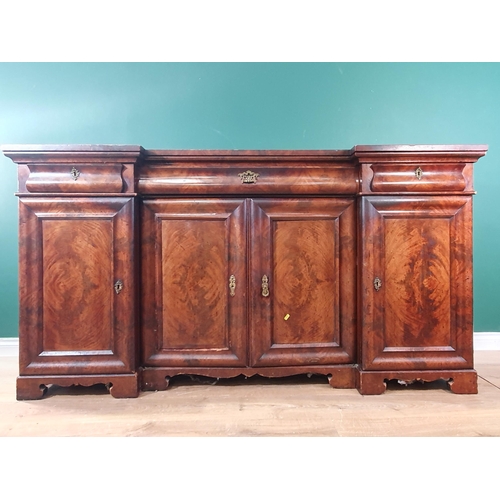 612 - A Victorian mahogany inverted Breakfront Sideboard fitted three frieze drawers above four cupboard d... 