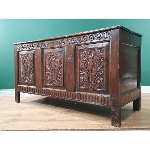 613 - A 17th Century oak Coffer with floral carved three panel front 4ft 6in W x 2ft 4in H (R7)