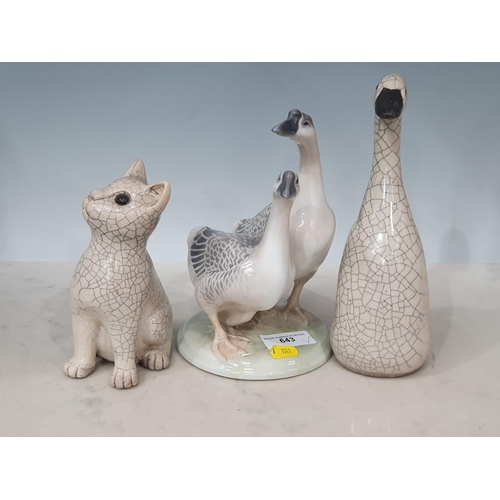 643 - A Royal Copenhagen Figure of a pair of Chinese Geese, a crackleware Figure of a Duck and a Cat (R7)