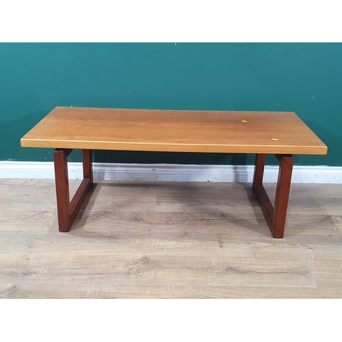 658 - A Mid Century Coffee Table, the rectangular top on square supports, 17