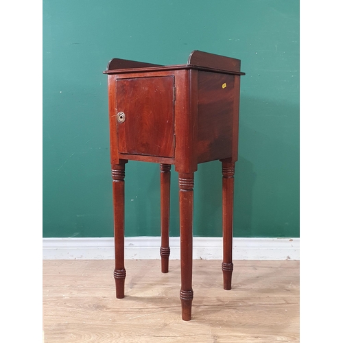 668 - A mahogany Pot Cupboard with raised shaped upstand, single fitted drawer, raised on turned tapered s... 