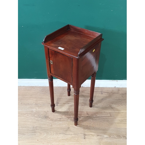 668 - A mahogany Pot Cupboard with raised shaped upstand, single fitted drawer, raised on turned tapered s... 