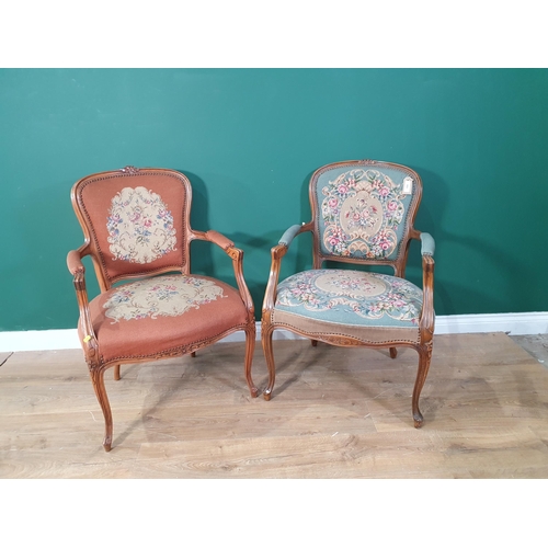 669 - A pair of French open Elbow Chairs one with green floral needlework upholstery, the other with simil... 