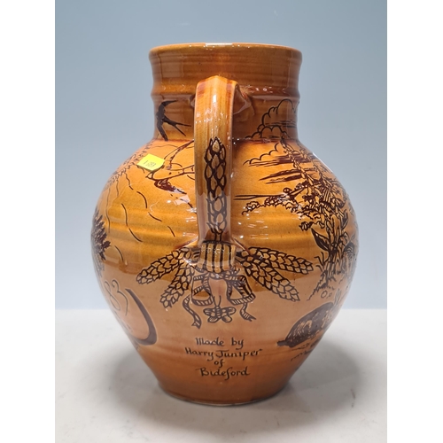 67 - HARRY JUNIPER (British, b.1933), Bideford Pottery Devon, a large Commemorative Harvest Jug depicting... 